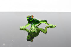 Jumping green glass  frog. Whimsical figurine with a lot of character and personality. Excellent addition to your glass collection.