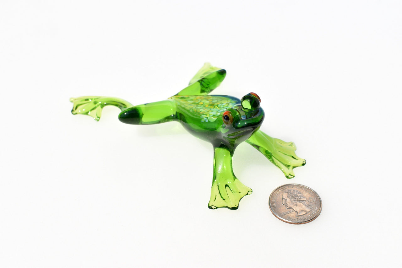 Jumping green glass  frog. Whimsical figurine with a lot of character and personality. Excellent addition to your glass collection.