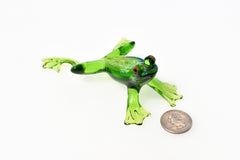 Jumping green glass  frog. Whimsical figurine with a lot of character and personality. Excellent addition to your glass collection.
