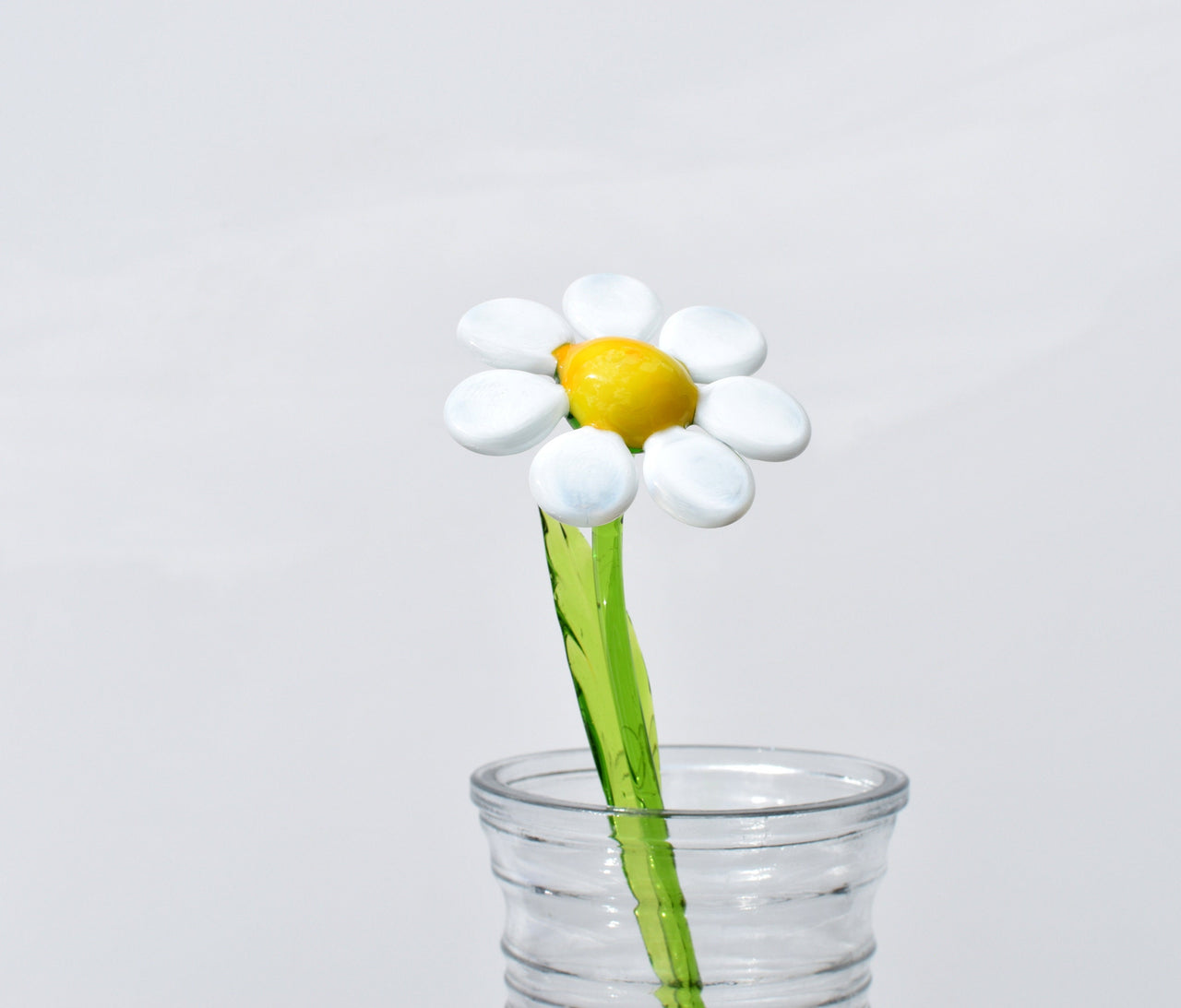 Beautiful long stem white-yellow glass daisy flower. Excellent addition to your glass collection. Each flower is priced individually.