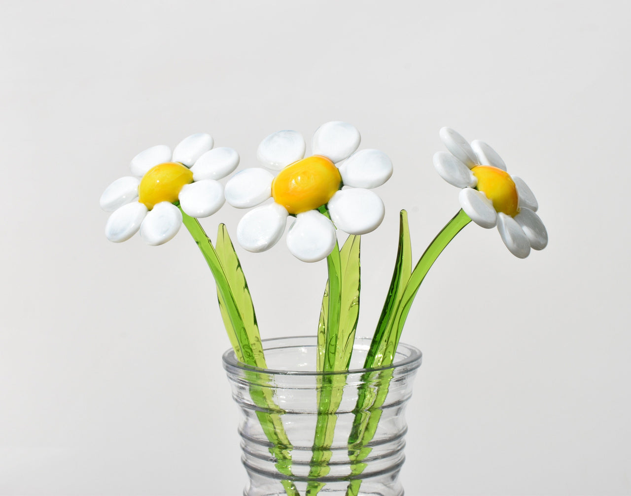 Beautiful long stem white-yellow glass daisy flower. Excellent addition to your glass collection. Each flower is priced individually.