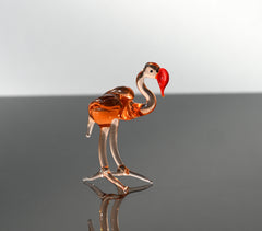 Rosy transparent Glass Flamingo. Detailed figurine with a lot of personality.  Excellent addition to your glass animals collection.