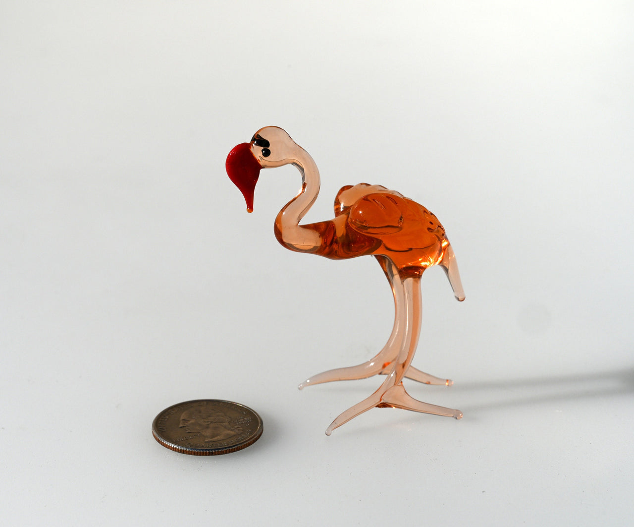 Rosy transparent Glass Flamingo. Detailed figurine with a lot of personality.  Excellent addition to your glass animals collection.