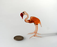 Rosy transparent Glass Flamingo. Detailed figurine with a lot of personality.  Excellent addition to your glass animals collection.
