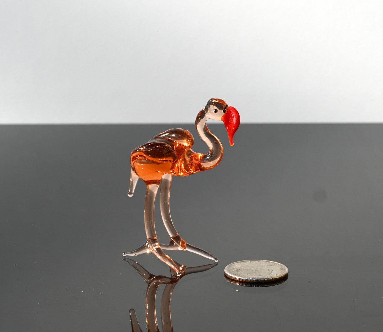 Rosy transparent Glass Flamingo. Detailed figurine with a lot of personality.  Excellent addition to your glass animals collection.