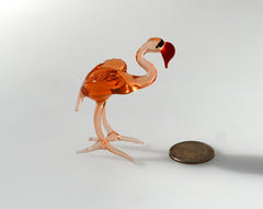 Rosy transparent Glass Flamingo. Detailed figurine with a lot of personality.  Excellent addition to your glass animals collection.