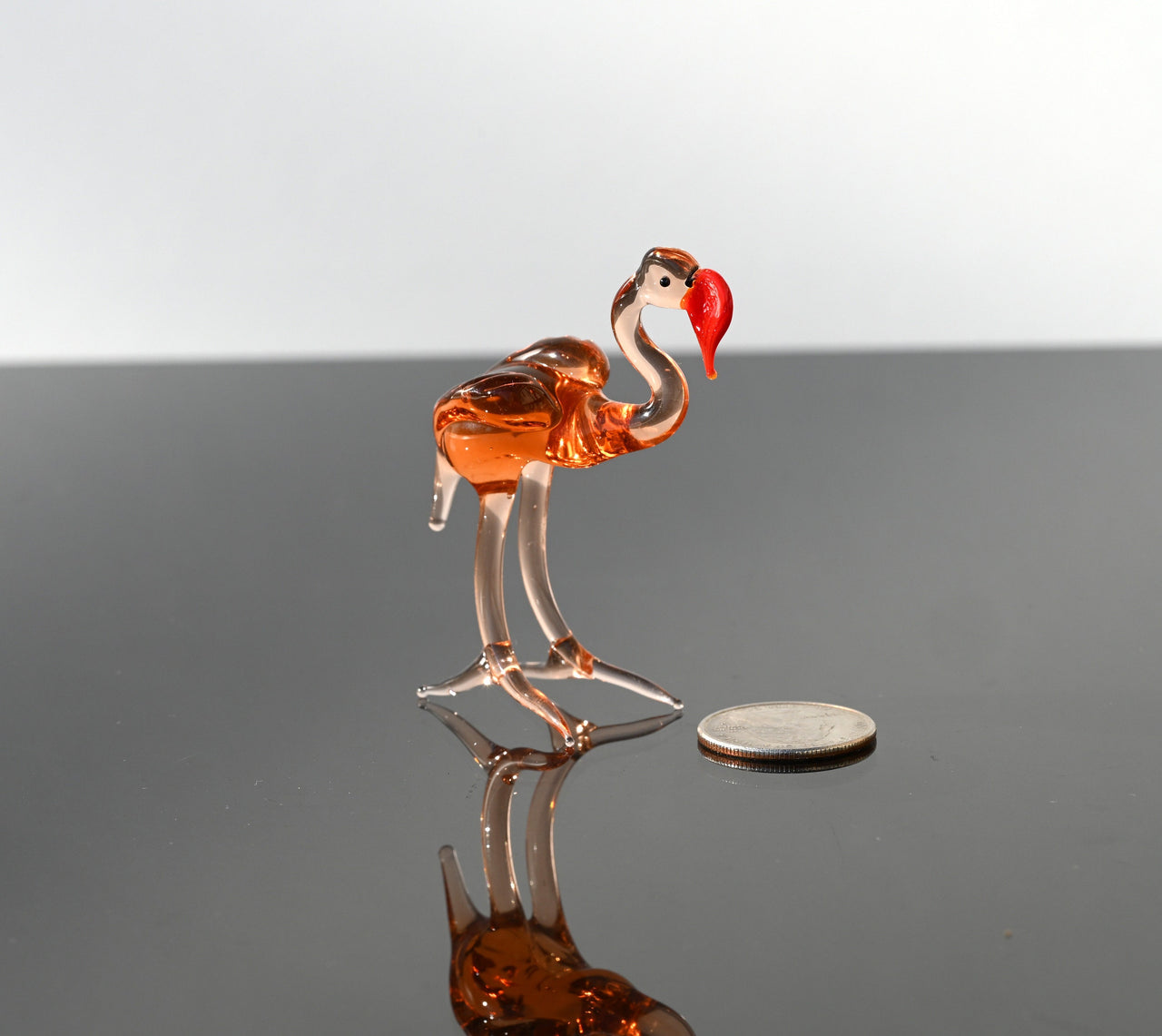 Rosy transparent Glass Flamingo. Detailed figurine with a lot of personality.  Excellent addition to your glass animals collection.