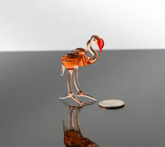 Rosy transparent Glass Flamingo. Detailed figurine with a lot of personality.  Excellent addition to your glass animals collection.