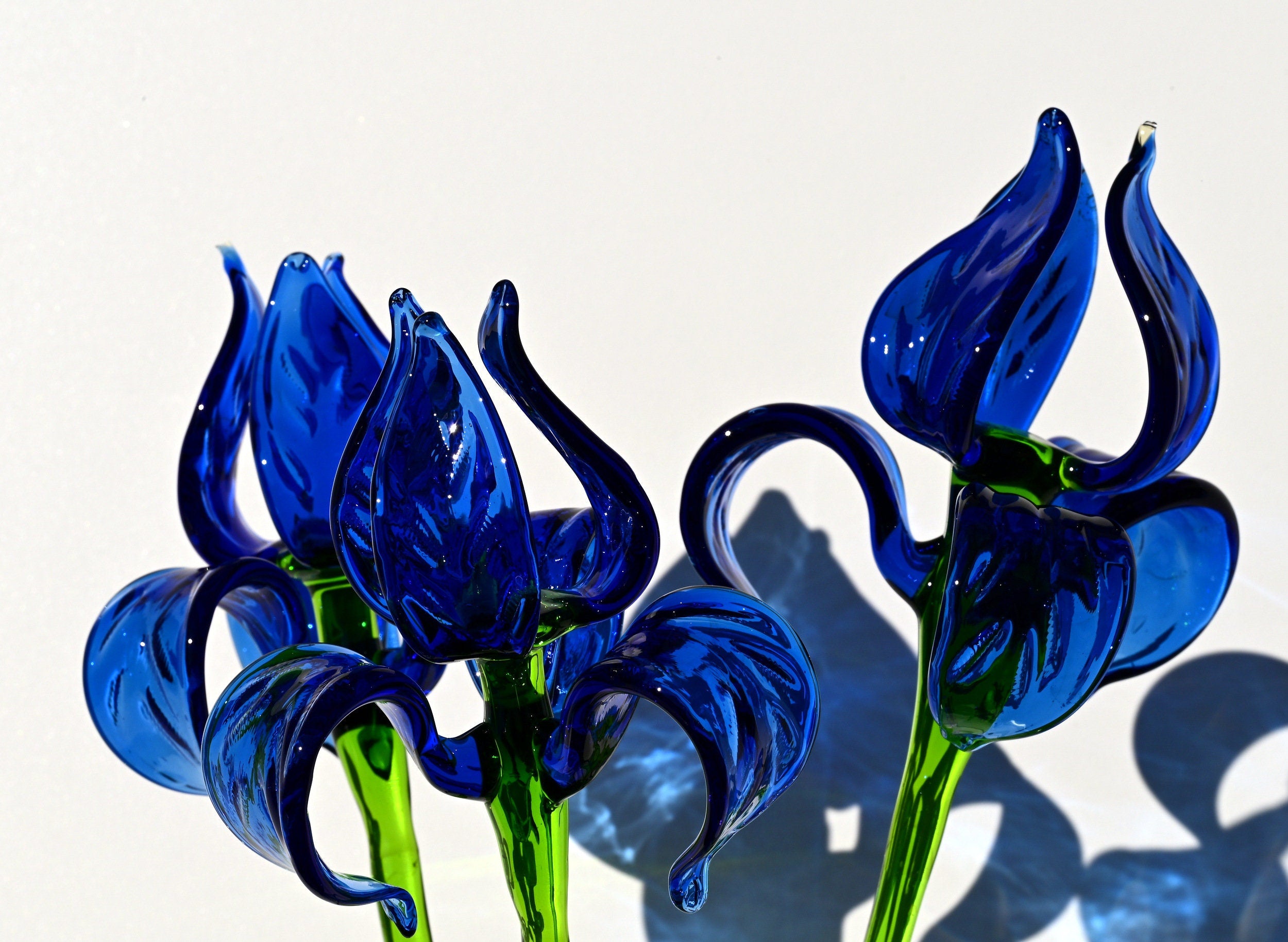 Beautiful extra long blue glass Iris flower. Excellent addition to your decor collection, unique gift. Each flower is priced individually.