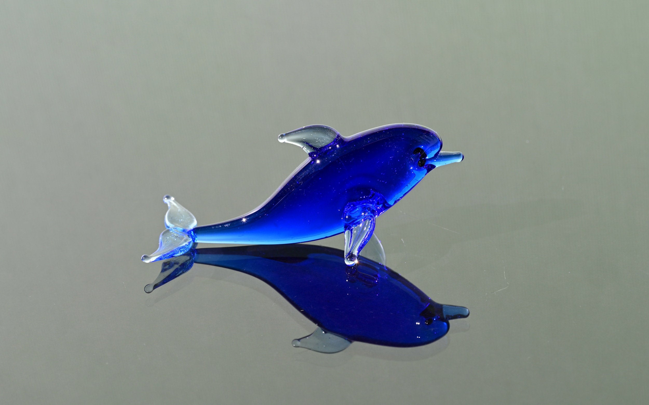Blue Glass Dolphin Figurine: Whimsical Handmade Sculpture
