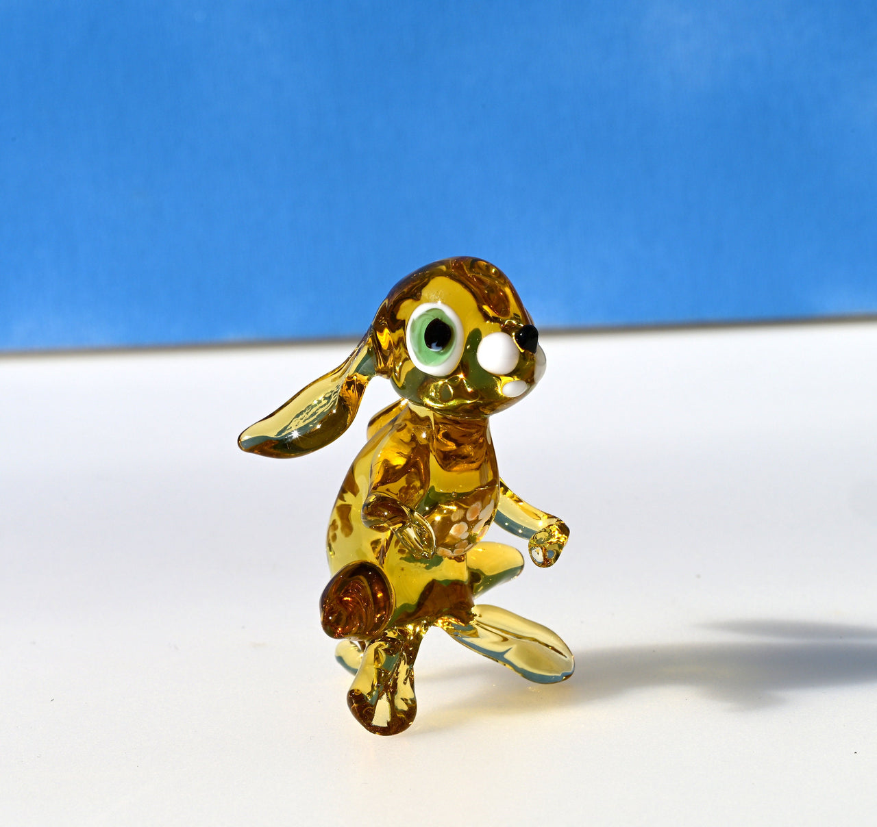 Handmade Amber Glass Bunny Figurine: Whimsical Sculpture