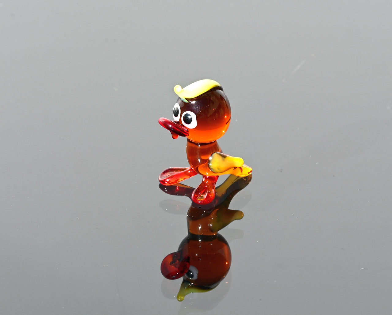 Handmade Amber Glass Tiny Duck: Whimsical Glass Menagerie Collectible