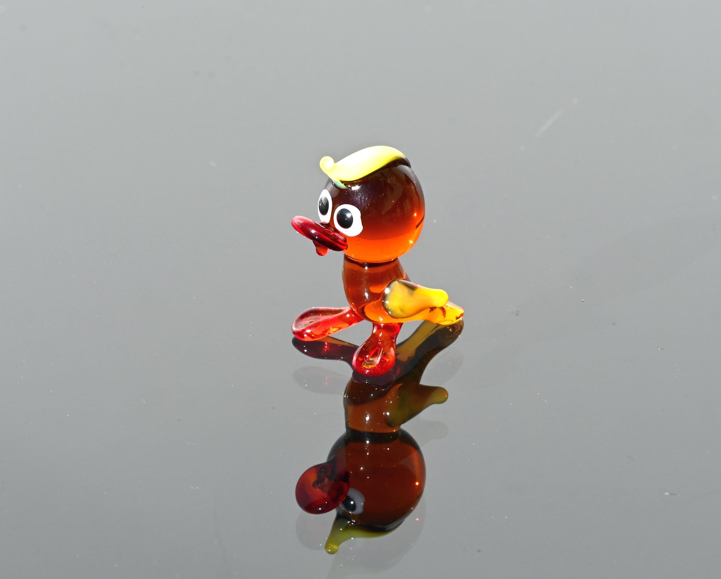 Handmade Amber Glass Tiny Duck: Whimsical Glass Menagerie Collectible