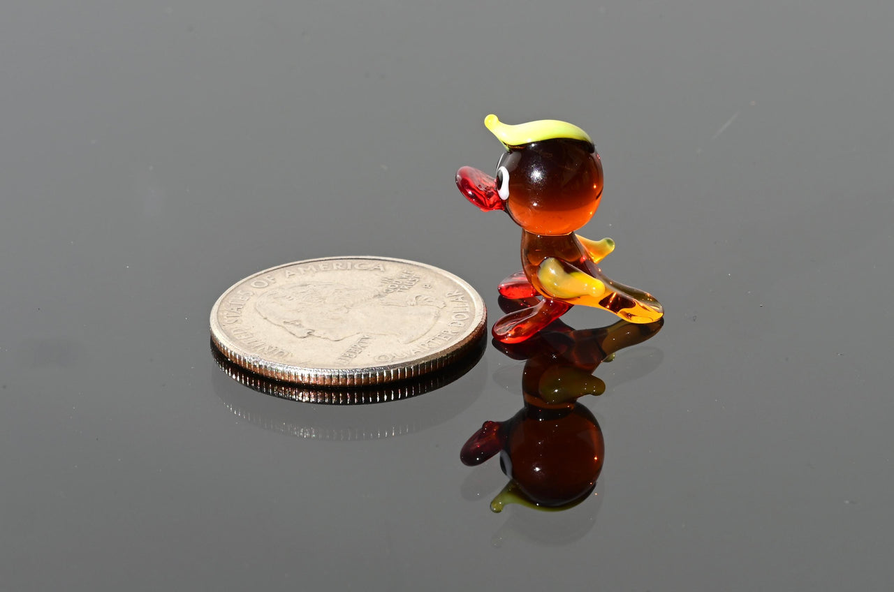 Handmade Amber Glass Tiny Duck: Whimsical Glass Menagerie Collectible
