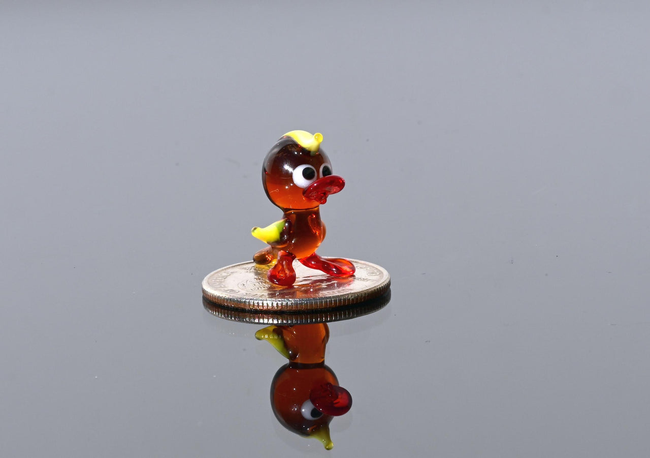 Handmade Amber Glass Tiny Duck: Whimsical Glass Menagerie Collectible