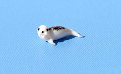 Seal, Tiny Glass Animals, Ocean Art, Sea Animals, Mini Glass Animals, Ocean Decor, Sea Creatures, Glass Figures, White Seal, Spotted Seal