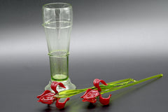 Two Deep red  13" Irises in a hand-blown transparent green glass vase, complete decor accent.