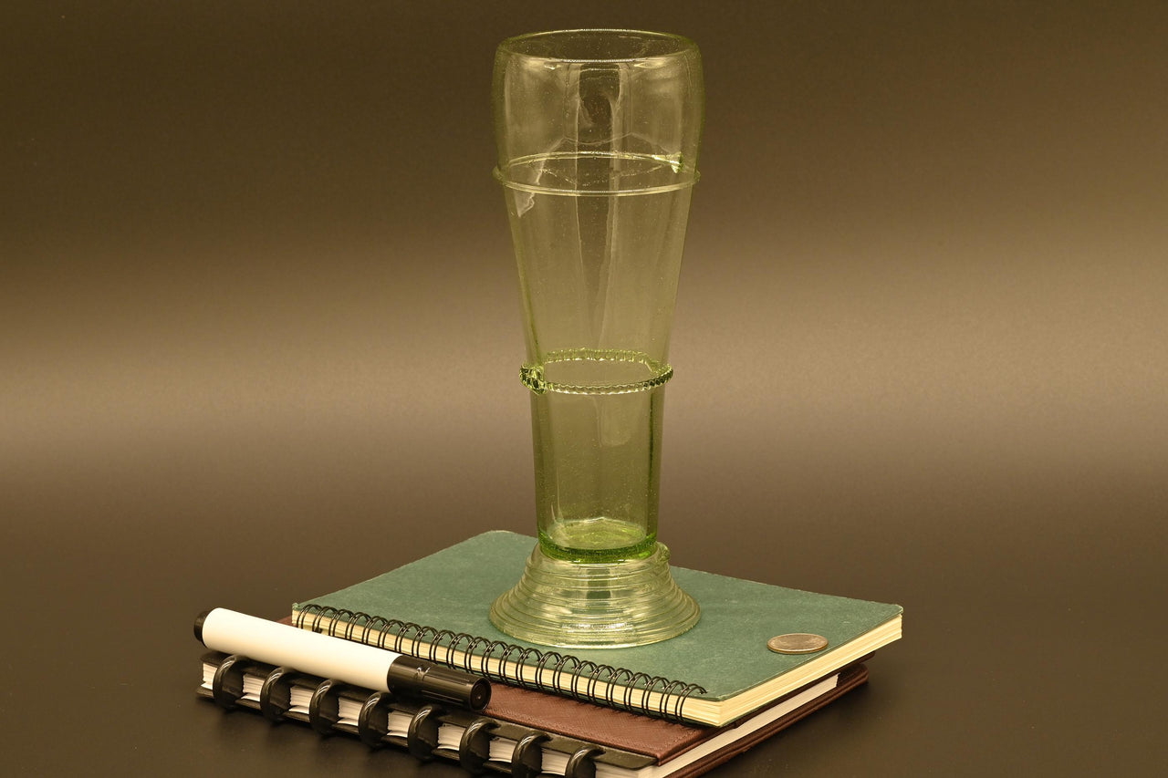 Two Deep red  13" Irises in a hand-blown transparent green glass vase, complete decor accent.