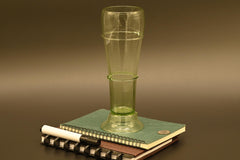 Two Deep red  13" Irises in a hand-blown transparent green glass vase, complete decor accent.