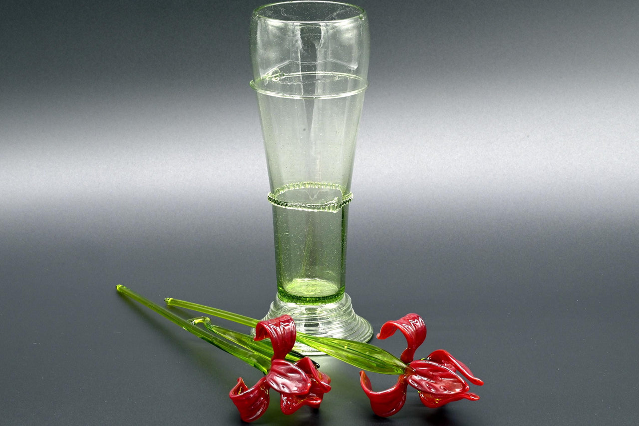 Two Deep red  13" Irises in a hand-blown transparent green glass vase, complete decor accent.