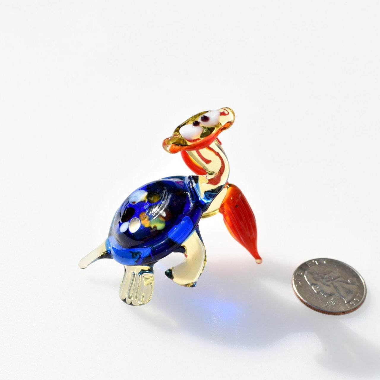 Hand Blown Glass Turtle with umbrella . Whimsical figurine with character and personality. Excellent addition to your collection.